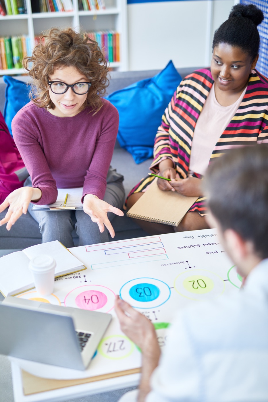 Colleagues brainstorming together in a modern office